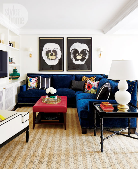 Blue velvet couch in chic living room