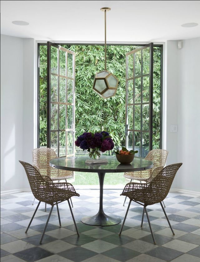 Dining area with tulip table, design by Nate Berkus